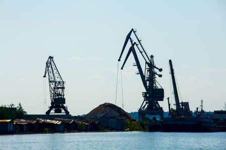 the mined sand cranes in the portの写真素材