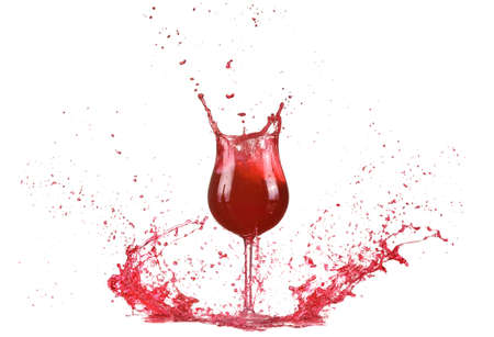 Glass with red wine, red wine splash, wine pouring on table isolated on white background, big splash aroundの写真素材
