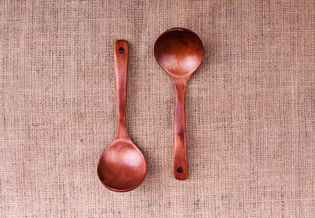 Wooden spoon on the linen cloth tableの写真素材