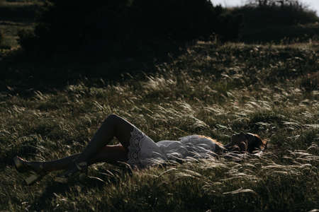 Trendy Hipster Girl Relaxing on the Grassの写真素材