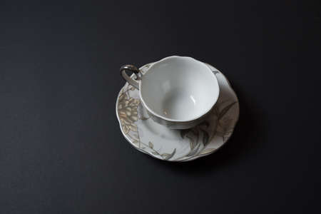 Empty cup on the black backgroundの写真素材