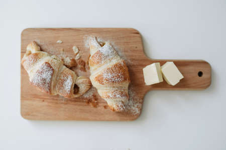 Homemade puff on the white table. Croissant with cheese and meatの写真素材