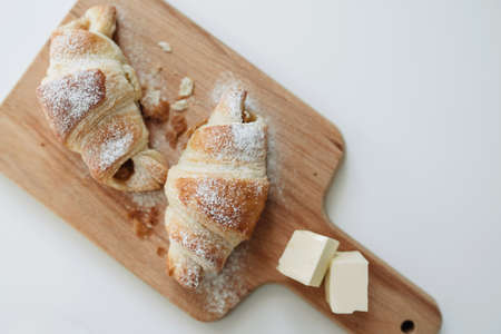 Homemade puff on the white table. Croissant with cheese and meatの写真素材