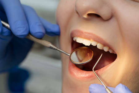 reception at the dentist. dentist at work in cabinetの写真素材