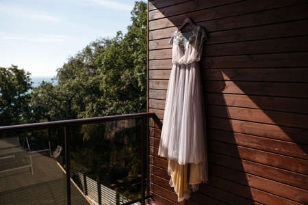 Tulle wedding dress and flower wedding decoration in boho style in the forest.の写真素材