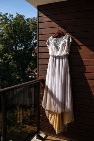 Tulle wedding dress and flower wedding decoration in boho style in the forest.の写真素材