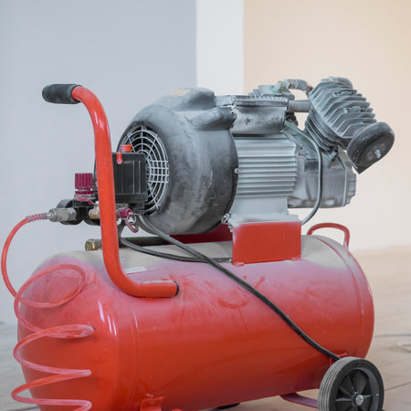 compressor in whitewash in the building where construction is underway. copyspace.