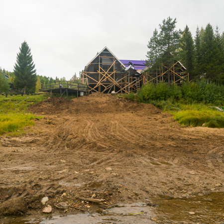 construction of a frame house on a high bank. concept development of low-rise constructionの写真素材
