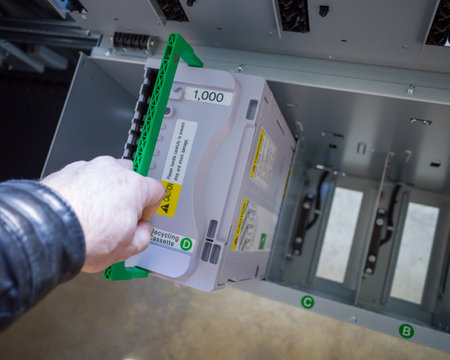 loading cash cassettes into the ATM dispenser. top view.の写真素材