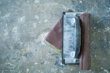 a tool for leveling and polishing walls during repair and renovation. concrete floor backgroundの写真素材