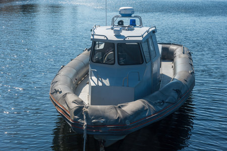 a modern motorboat of the police Coast Guard against poaching on the surface of the water. Emergency...