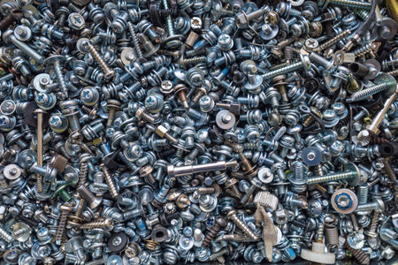 A background of many small bolts and washersの写真素材