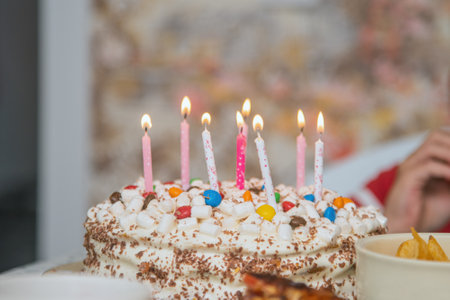 festive children's birthday cake with lighted candles. close up.の写真素材