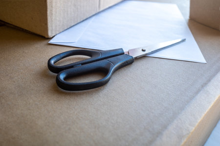 scissors on Cardboard box background, Online sales and packing ideas. close-upの写真素材