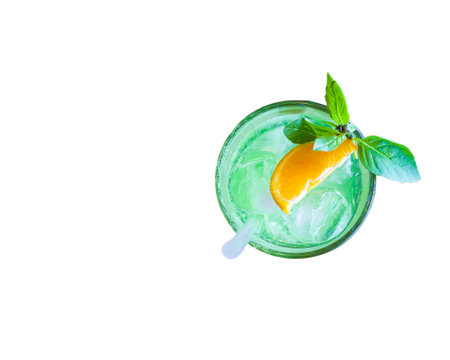 glass glass of lemonade with ice basil mint and a piece of orange. flatlay and copy space.の写真素材
