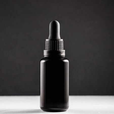 Essential Oil Bottle on White table and black Background. copy space.