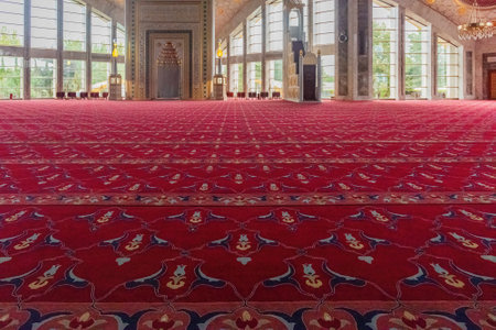red carpet in the mosque against the background of windows and daylight from themの写真素材