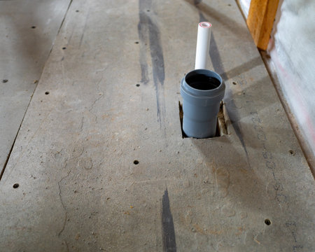 installation of sewer pipes in a frame house. copy spaceの写真素材