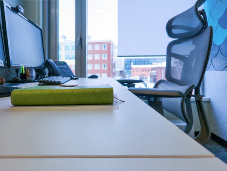 office workplace against a windowの写真素材