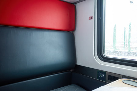 Traveling by train, Interior of a train with a window and comfy seats. Compartment No. 13.の写真素材