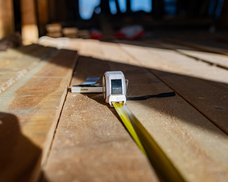 Carpenter meter ruler for dimension check, Wood planksの写真素材