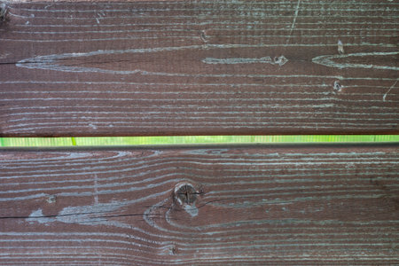 close-up view of weathered wooden planks with visible grain and knotsの写真素材