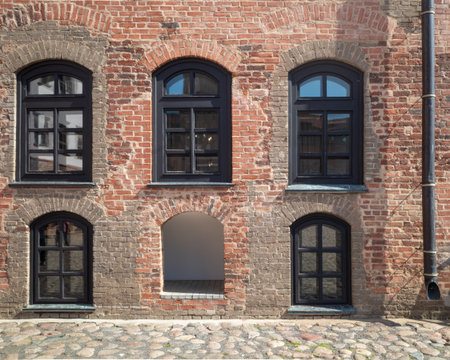 old Brick Building Facade with windowsの写真素材