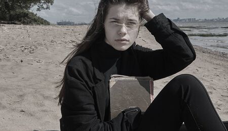 Portrait of beautiful brunette girl on beach