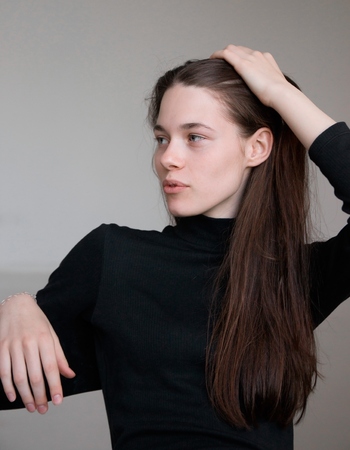 Portrait of beautiful brunette girl in studio