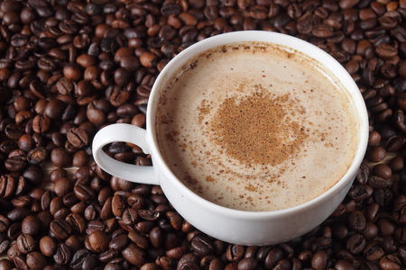 A cup of coffee with cinnamonの写真素材