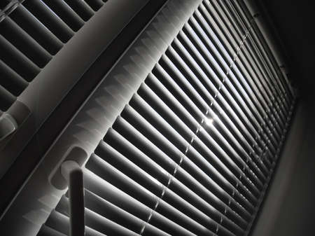 covered white blinds on the windowの写真素材