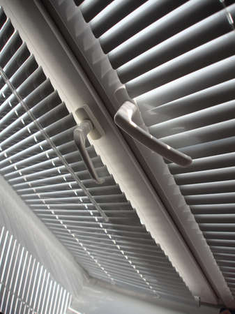 covered white blinds on the windowの写真素材