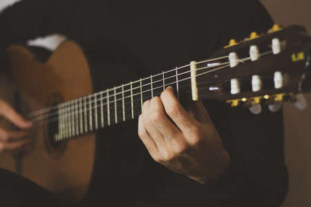Man playing classic guitar. Close upの写真素材