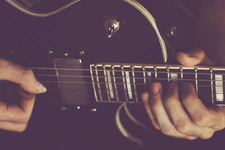 plays the electric guitar closeup, music backgroundの写真素材