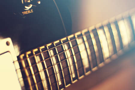 Electric guitar strings closeup. Vintage background