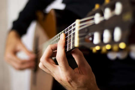 Plays classical guitar closeup, music backgroundの写真素材