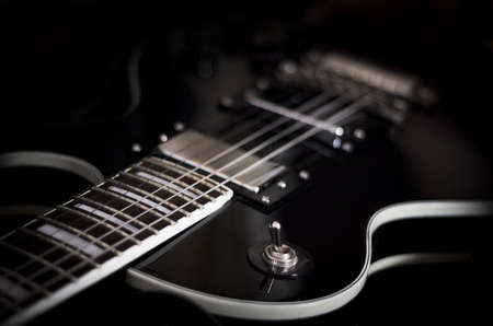Electric guitar detail on dark backgroundの写真素材