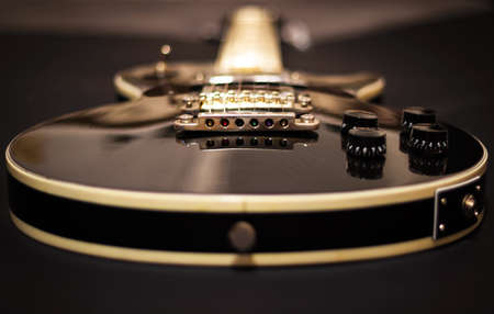 Black guitar close-upの写真素材