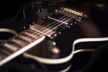 Electric guitar on dark background, music studioの写真素材