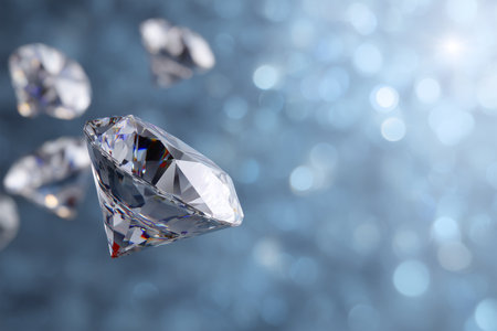 Shimmering diamonds floating in a blurred blue backgroundの素材