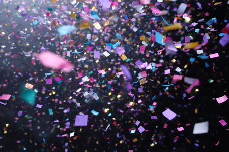 Colorful confetti falling during a festive celebration eventの素材