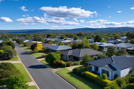 Scenic view of a quiet suburban neighborhood with lush greeneryの素材