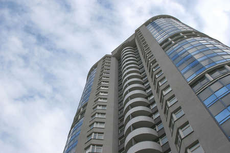 skyskraper and cloudy blue sky on the backgroundの写真素材