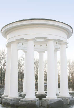 Antic building in the center of a little island in a city park