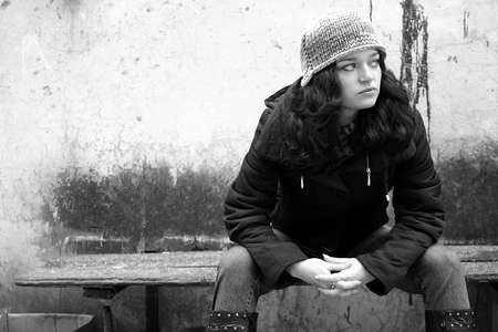 Young girl on the old benchの写真素材