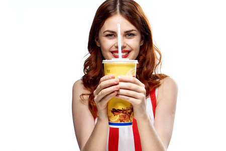 Woman with drink in hand, woman with glass of cold drink.の写真素材