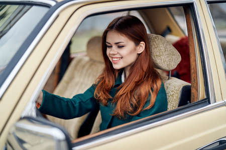Woman driving a car, a woman sitting in the car.の写真素材