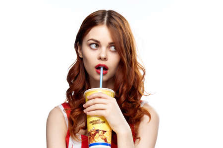 Surprised woman with glass on isolated background.の写真素材