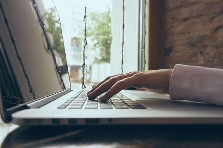 Business woman working behind laptop in office.の写真素材