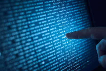 Binary system, programming, code, numbers, business, people and technology concept.の写真素材